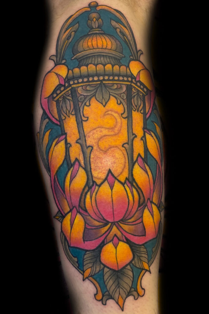 illustrative color tattoo, neotraditional lantern surrounded by a chrysanthemum, done by Houston tattoo artist