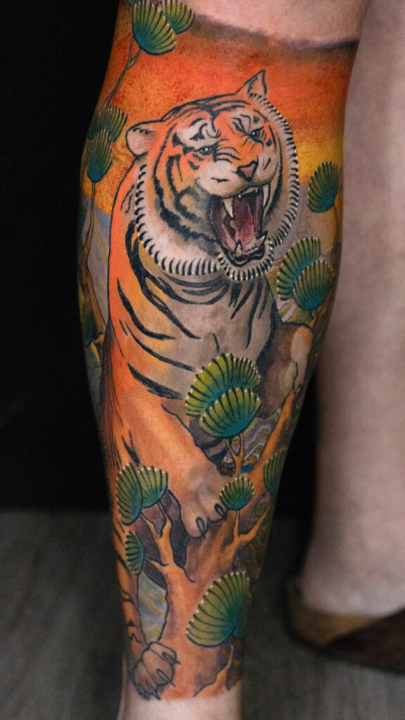 illustrative Japanese tiger tattoo on a moss style tree, color, done by Houston tattoo artist