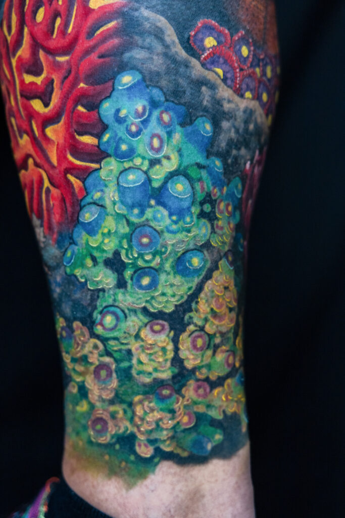 extremely detailed color realism tattoo of coral with vivid greens and yellows, done by Houston tattoo artist