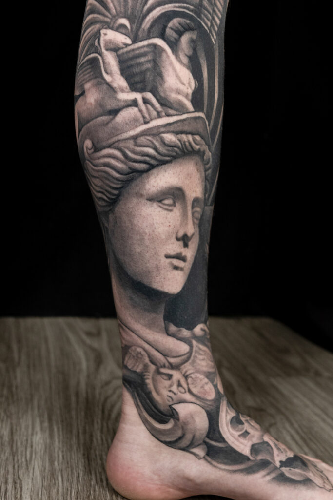 statuesque black and grey tattoo of warrior Athena with armor done by a Houston tattoo artist, healed