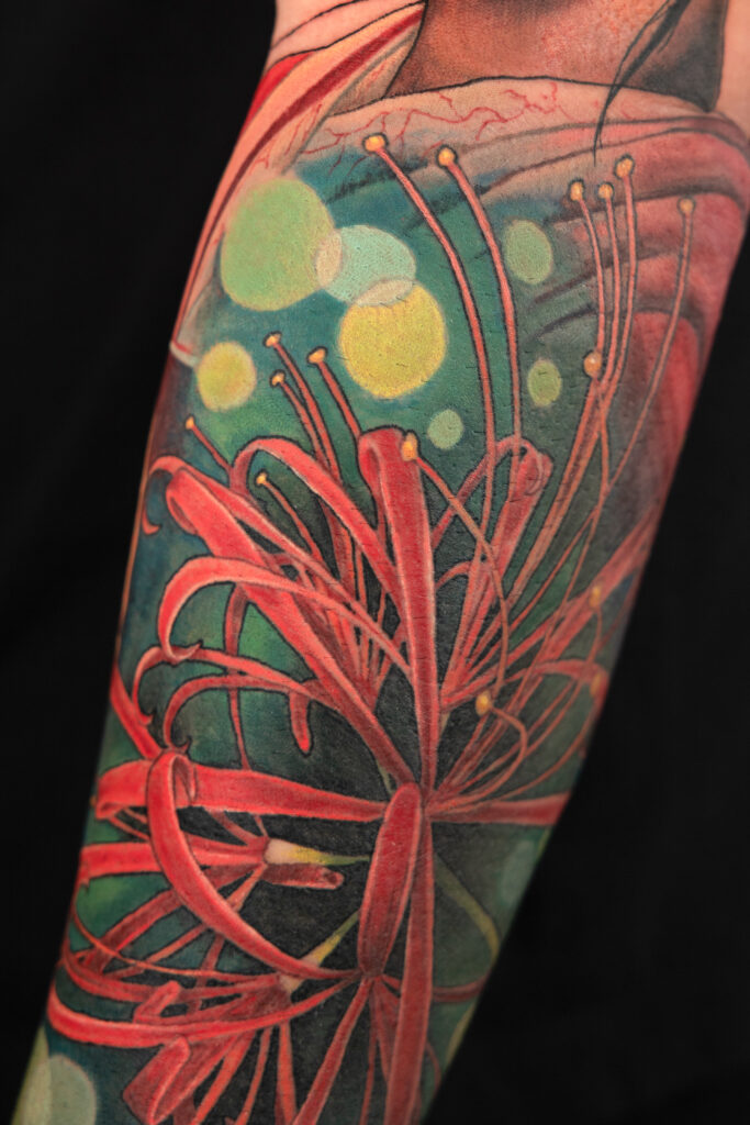 color realism work and progress tattoo with bokeh color. smooth shading, don't by a Houston tattoo artist, mainly a red Japanese spider lily